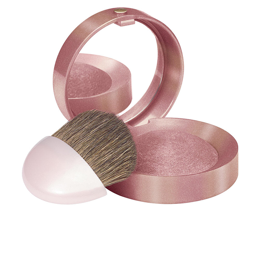 Round baked compact blush in soft rose shade with mirror and small brush