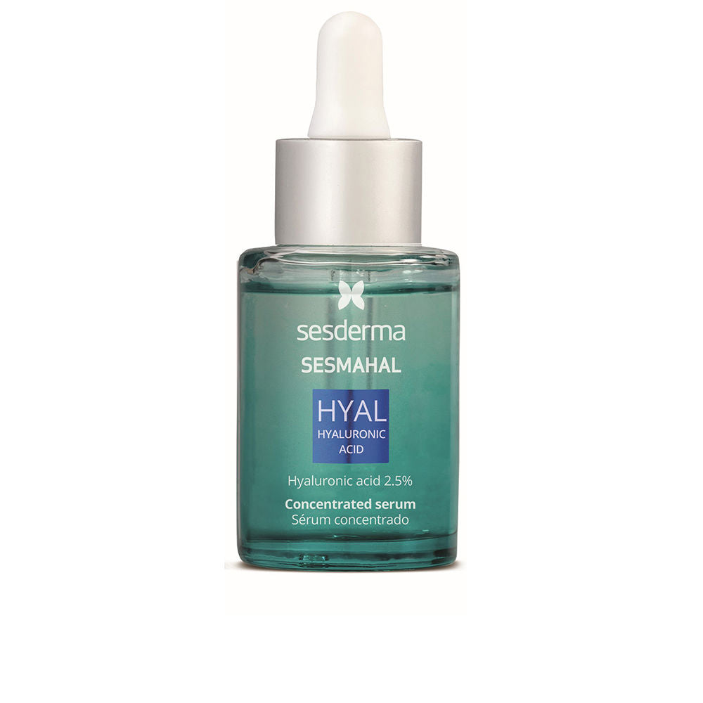 Sesderma Clear glass dropper bottle holding pale golden serum, labeled concentrated hyaluronic and vitamin C formula