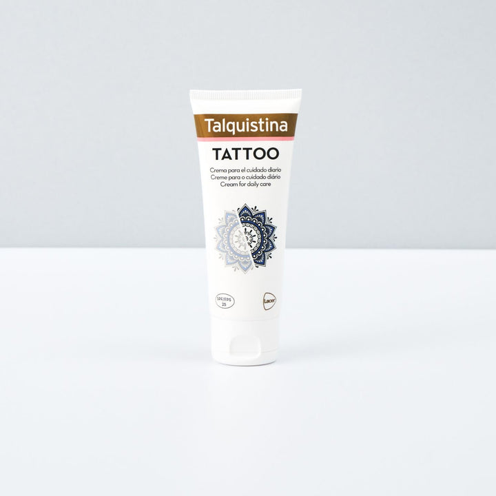 Jar of Talquistina tattoo care cream beside a tattoo sleeve, clean studio setting