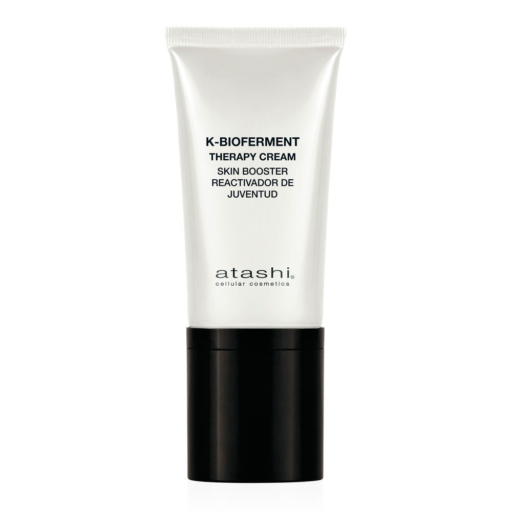 Atashi Minimalist plastic tube of white, blue, and yellow skincare cream with flip-top cap