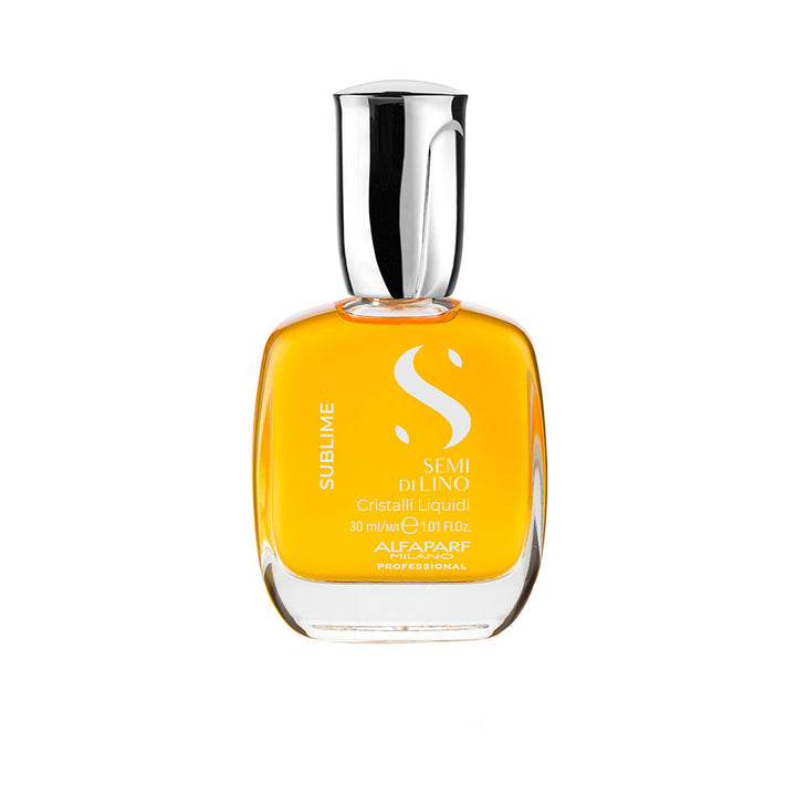Small 30 ml bottle of light‑reflective hair serum with golden oil, for Unisex use