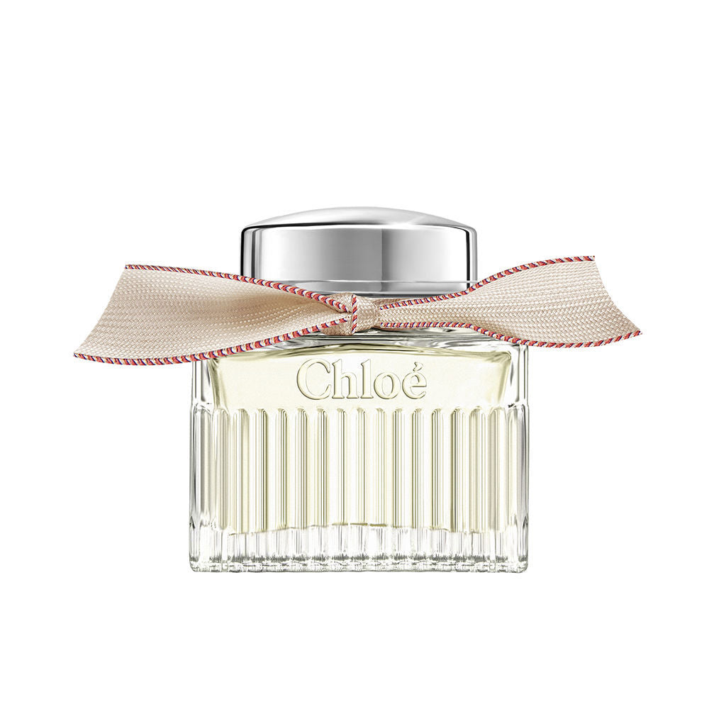 50 ml clear glass perfume bottle with beige ribbon and silver cap, floral scent