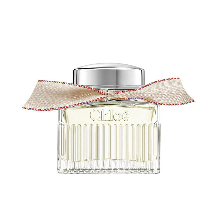 50 ml clear glass perfume bottle with beige ribbon and silver cap, floral scent