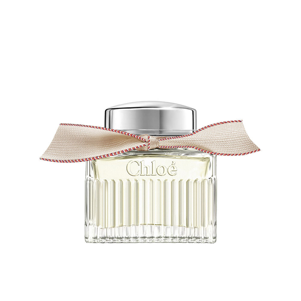 50 ml clear glass perfume bottle with beige ribbon and silver cap, floral scent