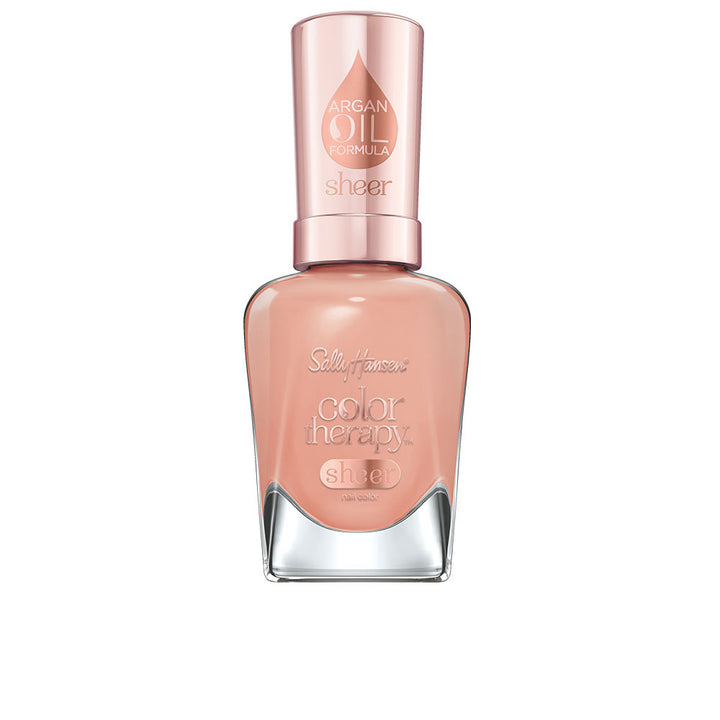 Bottle of sheer pink nail polish with argan oil, 14.7 ml, named Pink Moon