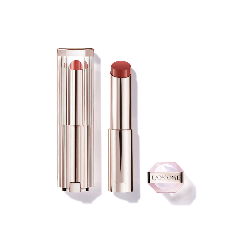 Tinted butter-glow lip balm tube in warm brown shade, glossy finish