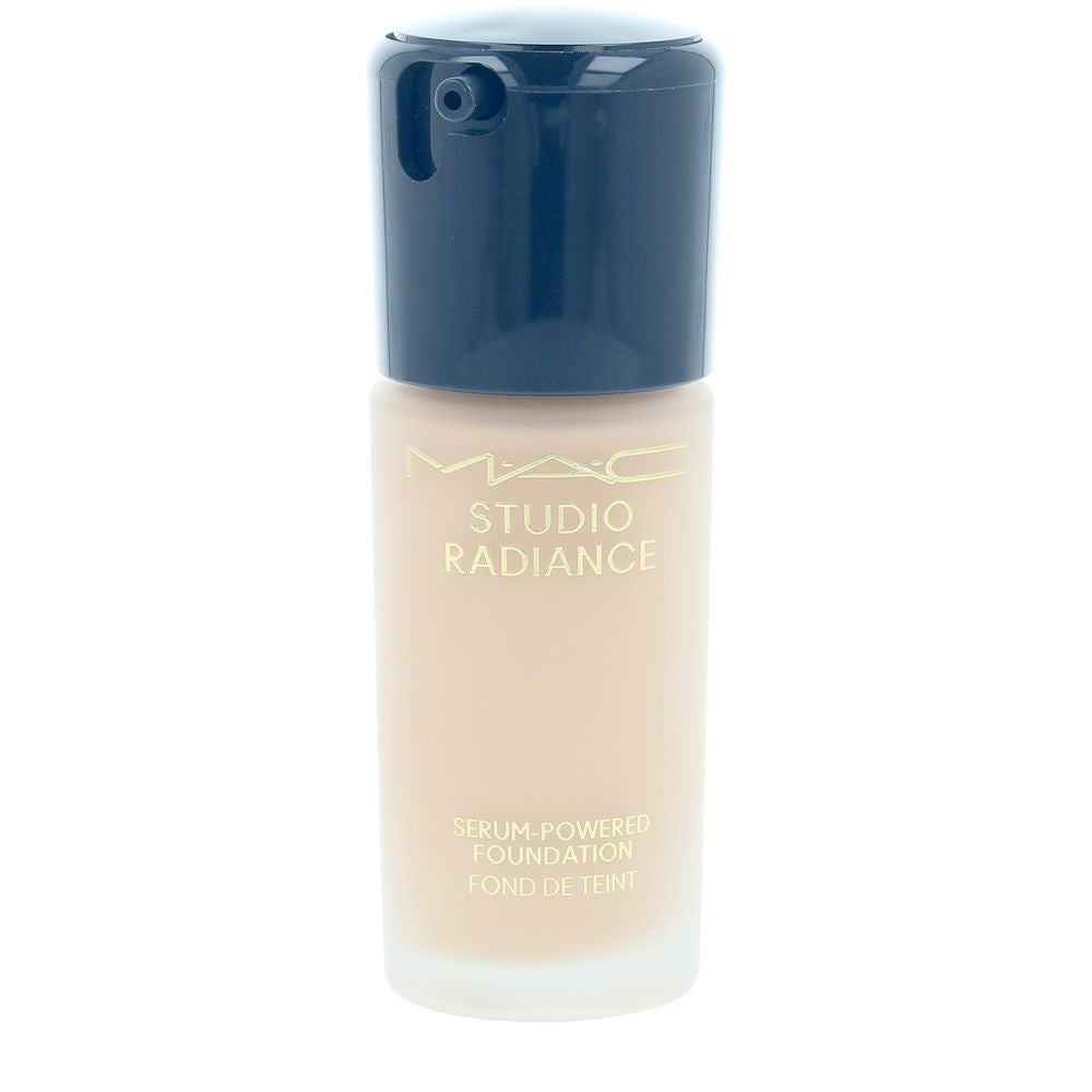 Mac Beige liquid foundation in frosted glass bottle with black pump, gold text, cylindrical silhouette