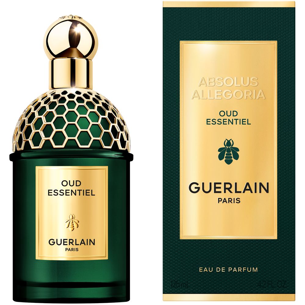 Guerlain Green glass perfume bottle and matching box with gold metallic cap, honeycomb pattern and bee icon