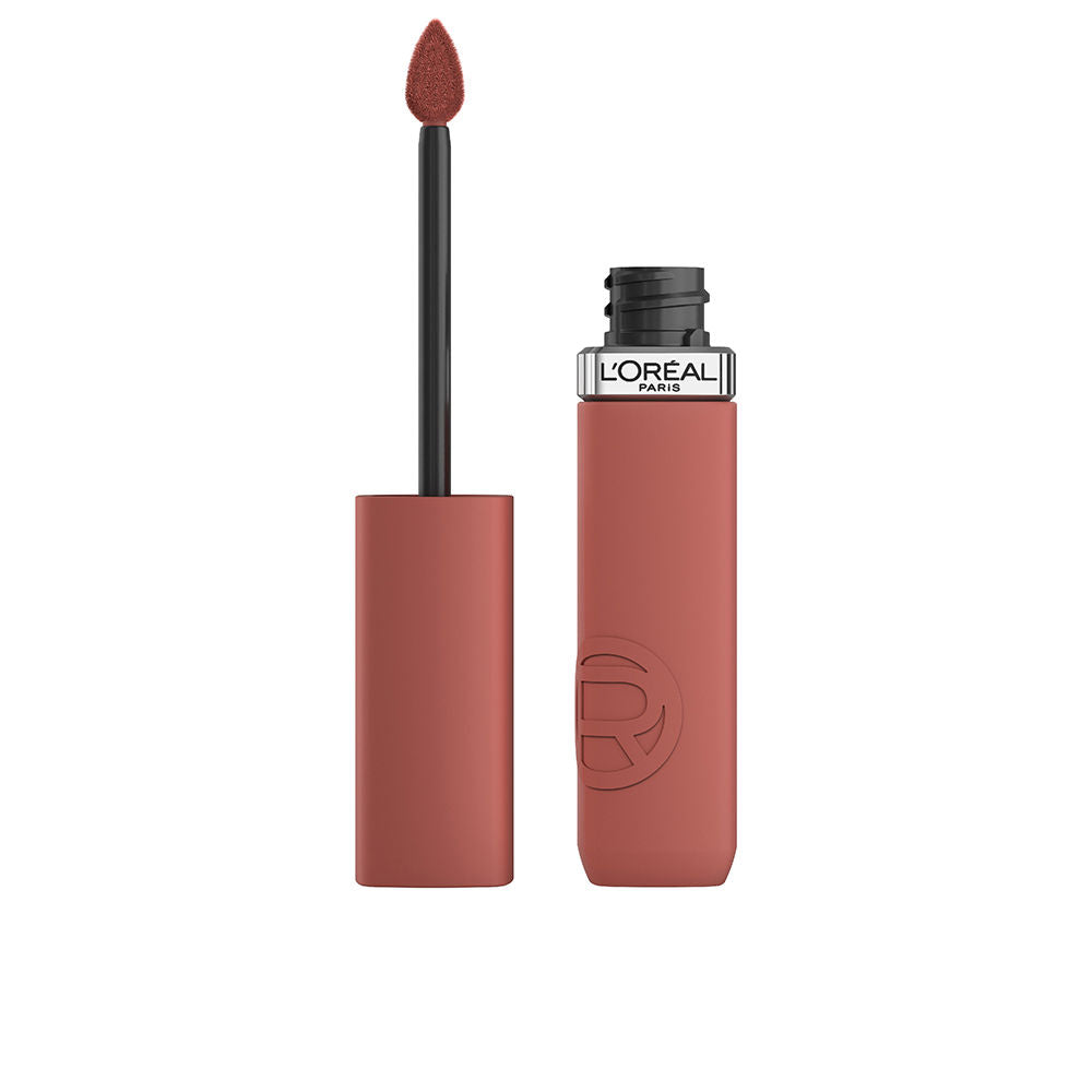 Tube of lightweight matte liquid lipstick in muted rose shade, applicator wand visible