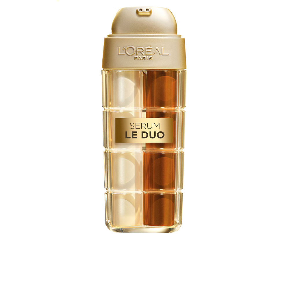 Gold and amber dual-chamber plastic serum bottle with pump, transparent panels, embossed L'Oréal Paris