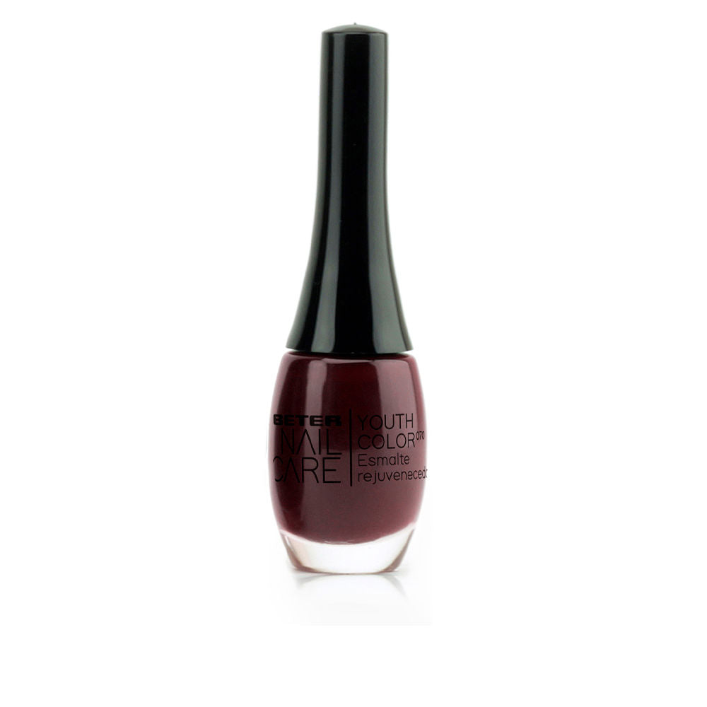11 ml bottle of deep rouge‑noir glossy nail polish, Unisex treatment lacquer
