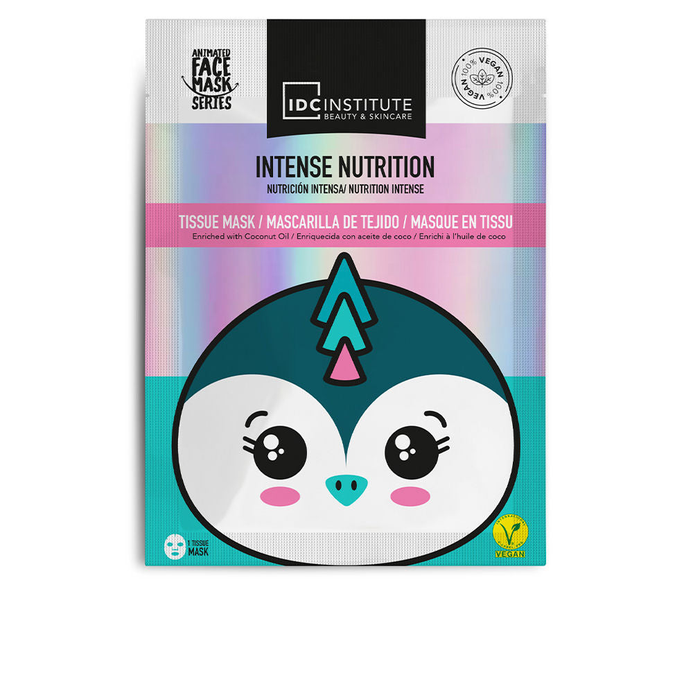 IDC Institute Teal and white tissue sheet mask with animated penguin face, holographic background, pink banner, vegan logo