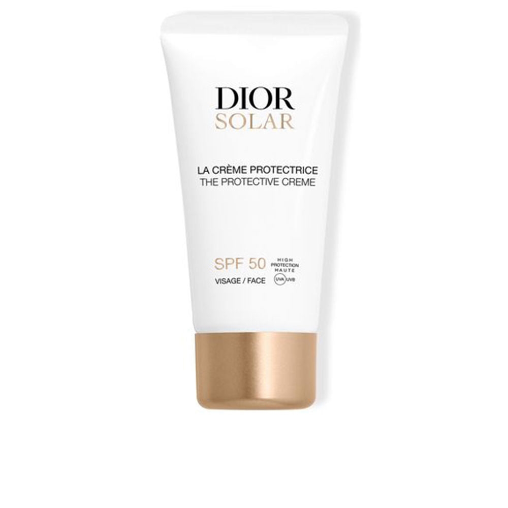 Dior White plastic sunscreen cream tube with gold cap, printed text and SPF label, photographed simply