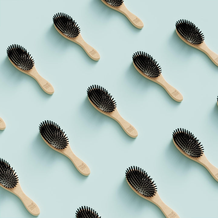 Lacquered beechwood paddle brush with boar bristles and nylon pins
