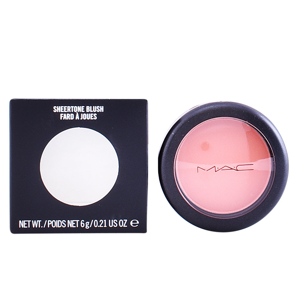 Soft pink powder blush in round container with black rim and transparent lid, MAC logo visible