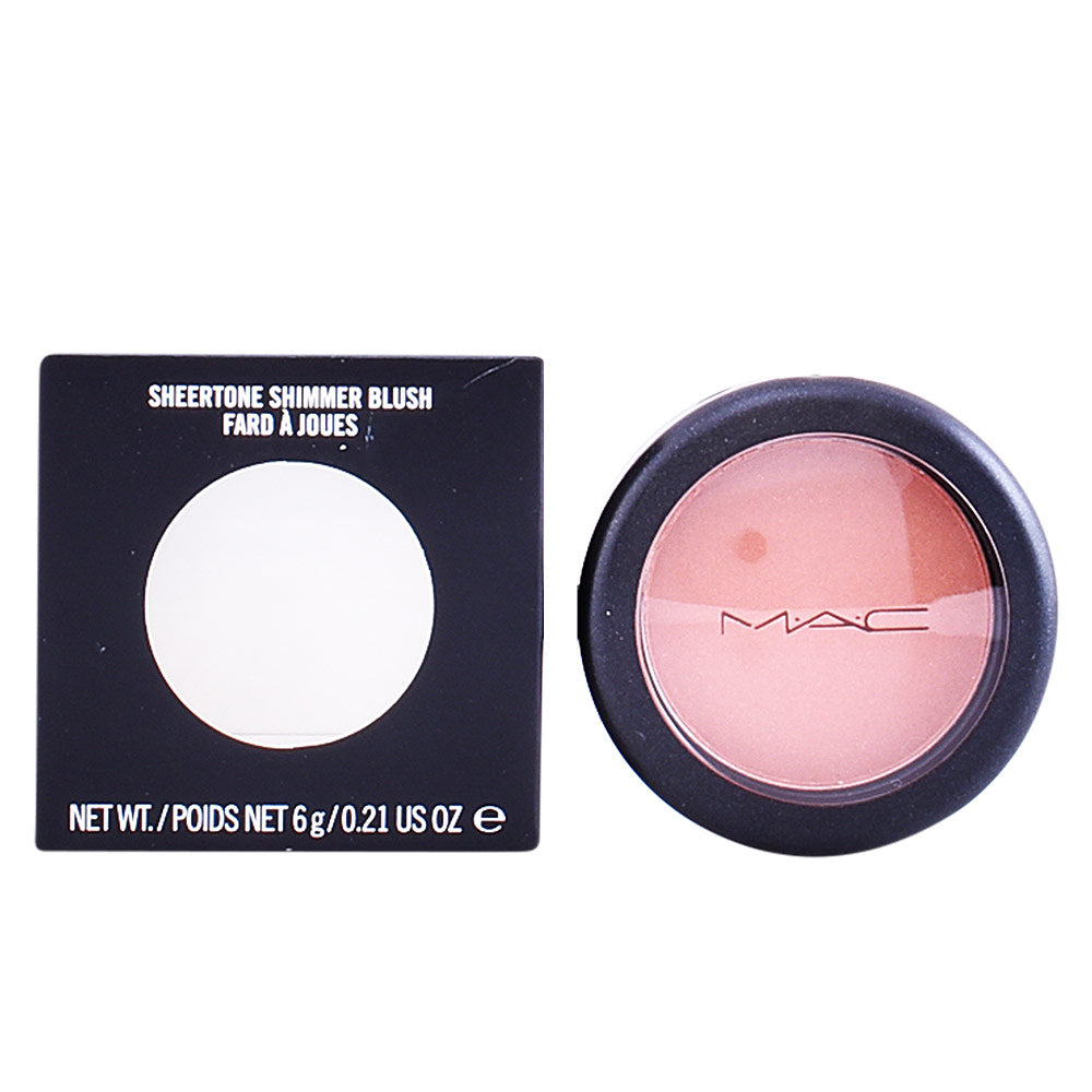 Peachy pink shimmer pressed-blush in round plastic compact with transparent lid, black rim, MAC logo