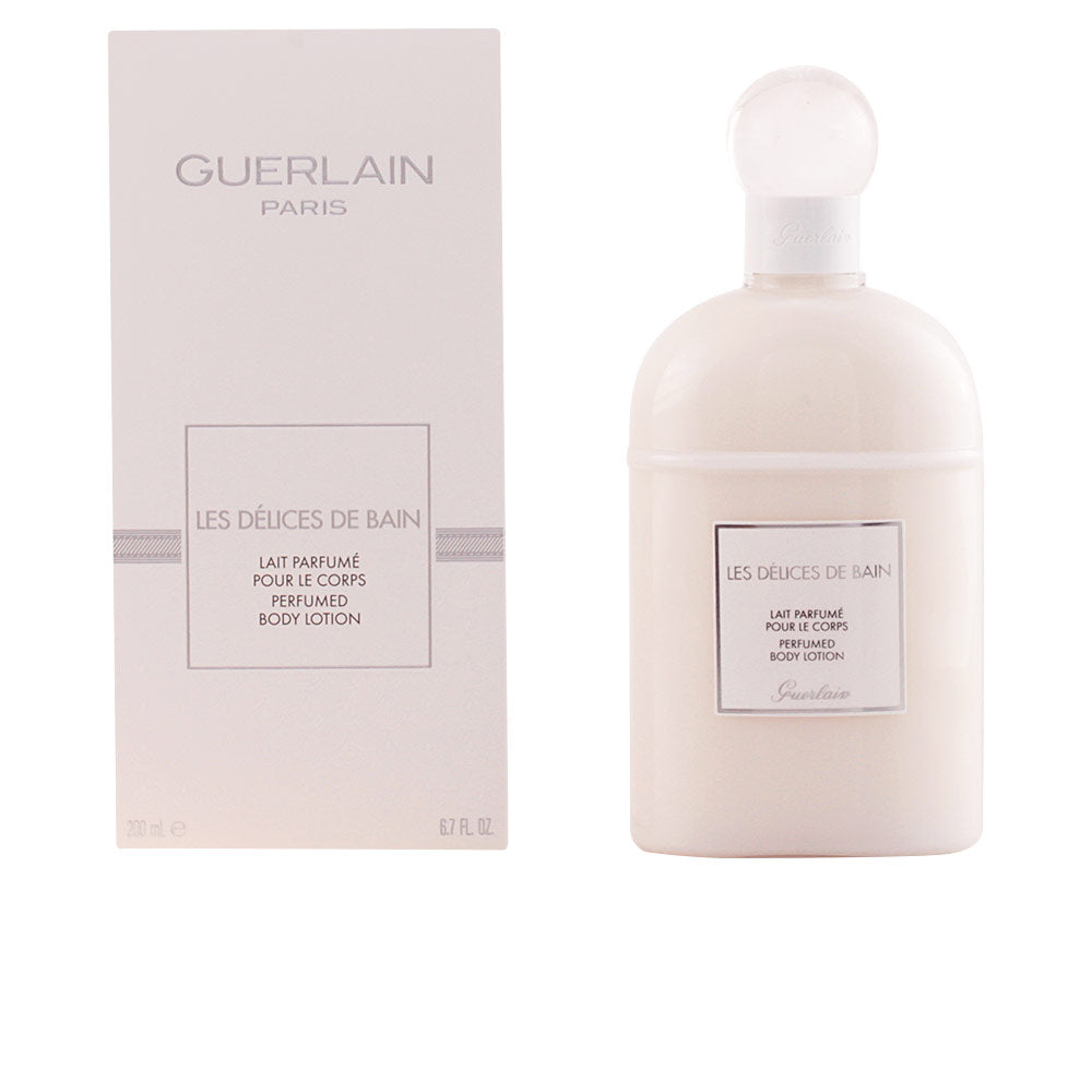 Guerlain Off-white minimalist rounded bottle with round cap and label, rectangular box beside it — .