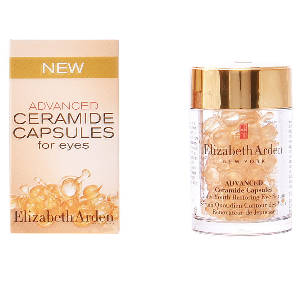 Elizabeth Arden Gold and beige single-dose eye serum capsules in clear plastic container with golden lid, refined modern styling.