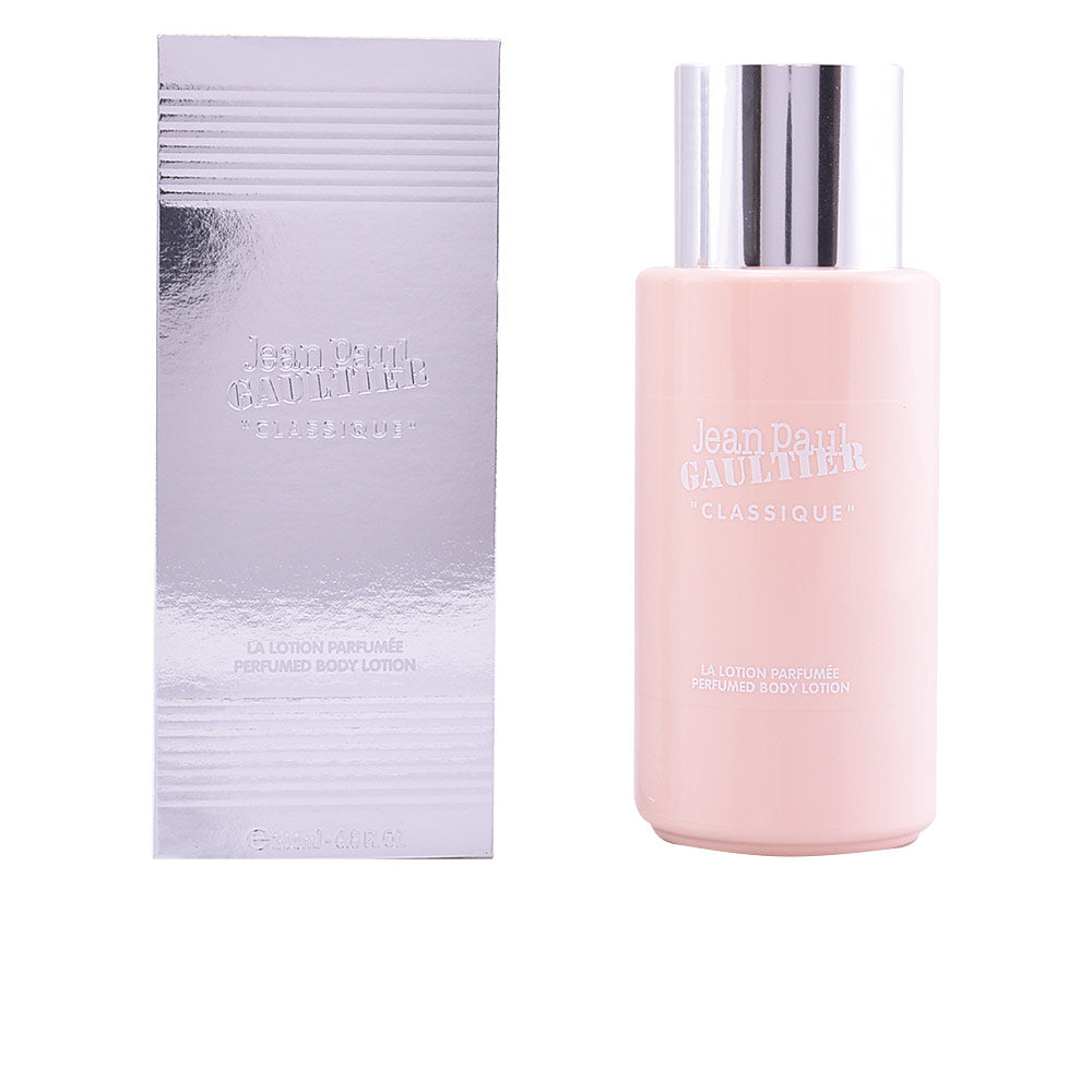 Jean Paul Gaultier Light pink cylindrical body lotion bottle with metallic silver cap, embossed text and reflective box, minimalist modern