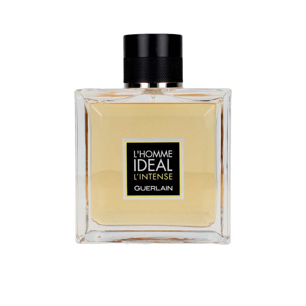 Clear square glass bottle with light amber liquid, black textured cap and simple front label, Guerlain.