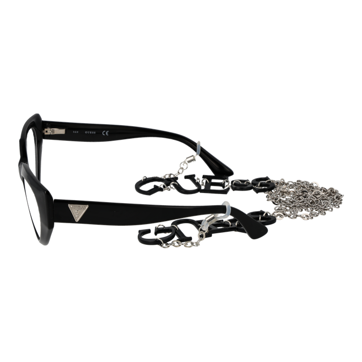 Black cat-eye eyeglasses with plastic frame and metal lettered chain draped against neutral background