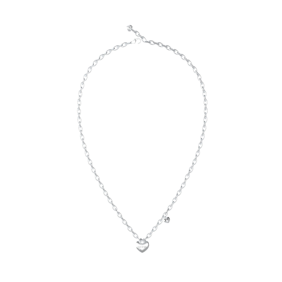 Silver linked chain necklace with brushed heart pendant and small dangling heart charm on white background