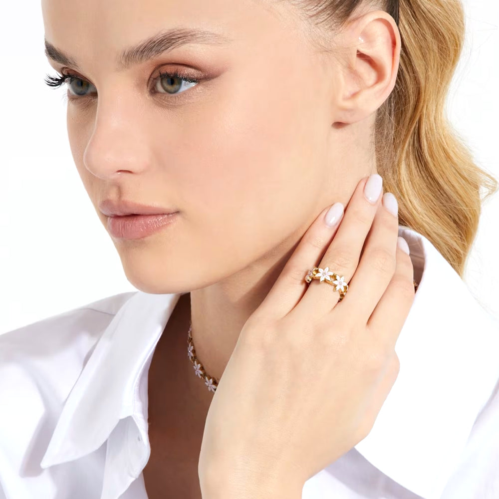 Gold floral ring for Women with pink gemstone center and white accent details on metal band