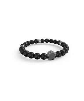Black beaded bracelet with silver accent beads and textured metal disc on neutral background