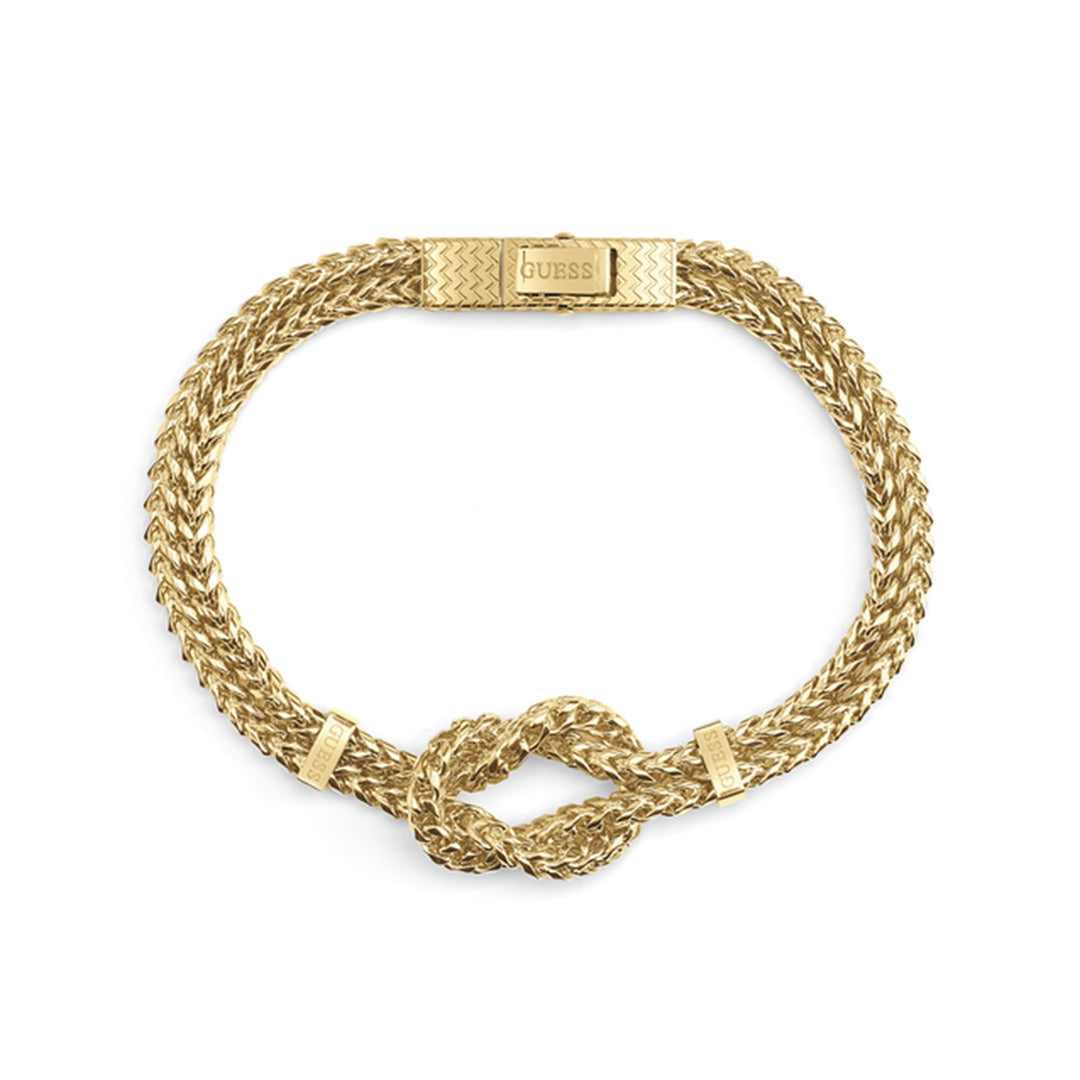 Gold-tone braided chain bracelet with knot detail and patterned clasp on neutral background