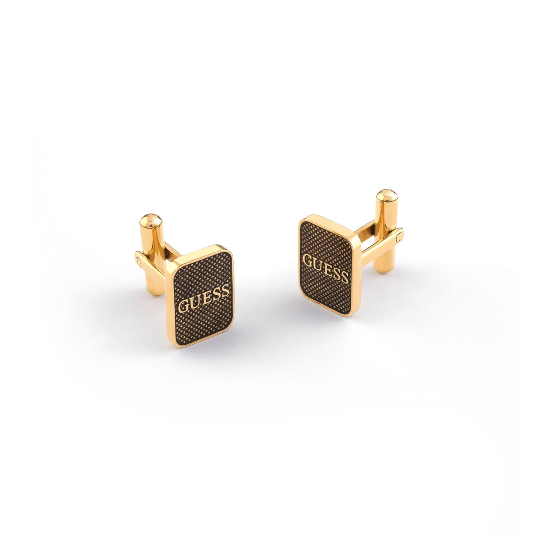 Gold rectangular cufflinks with textured black enamel panel and GUESS logo on cufflinks display