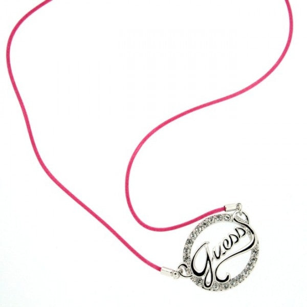 Silver round metal pendant with rhinestones and Guess script on a thin pink and black fabric cord