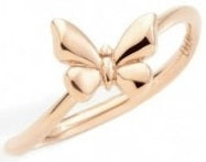 Rose gold delicate butterfly ring on finger, filigree openwork and polished finish