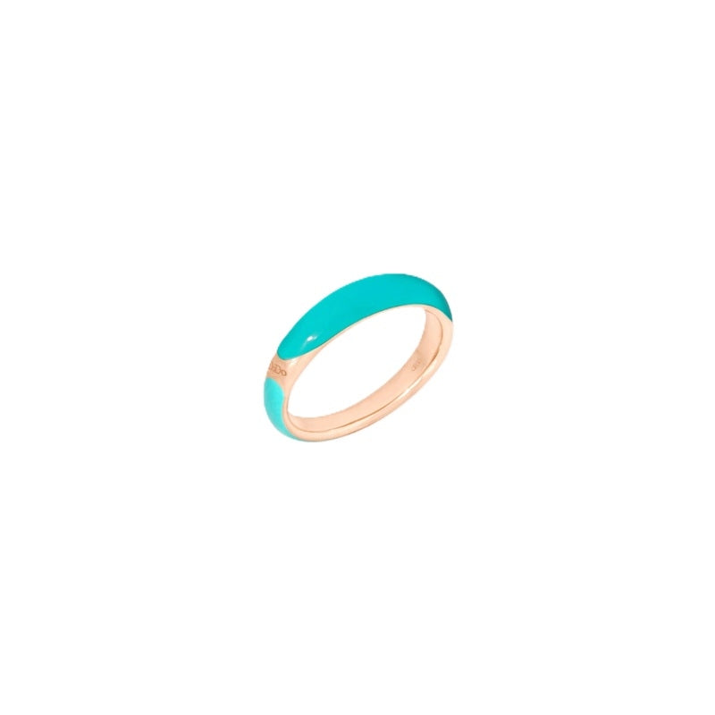 Turquoise enamel ring set in rose gold showing smooth two-tone finish on solid band
