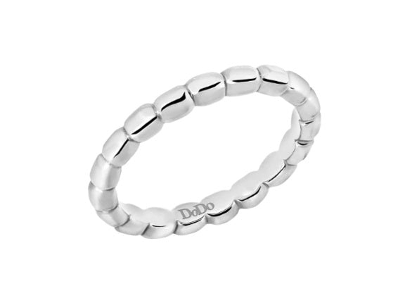 Close-up of a polished sterling silver beaded ring on neutral background, showing continuous bead detail