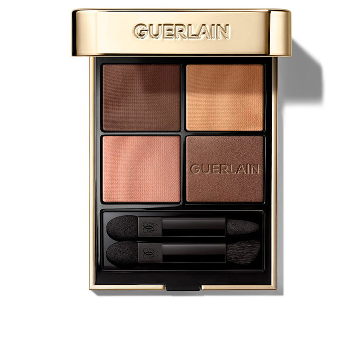 Compact four‑shade eye palette in jewel case with velvet sleeve and applicators