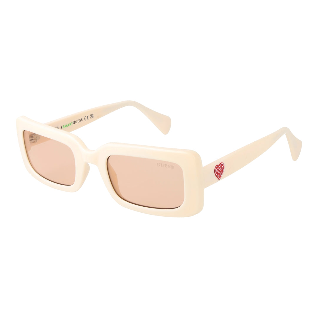Cream chunky rectangular sunglasses with pink tinted lenses, GUESS logo on lens and red heart on temple