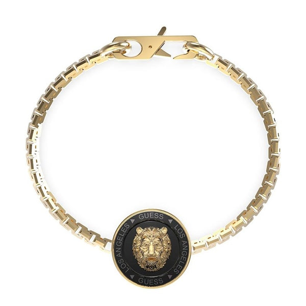 Gold chain bracelet with black accents and lion medallion on circular medallion close-up