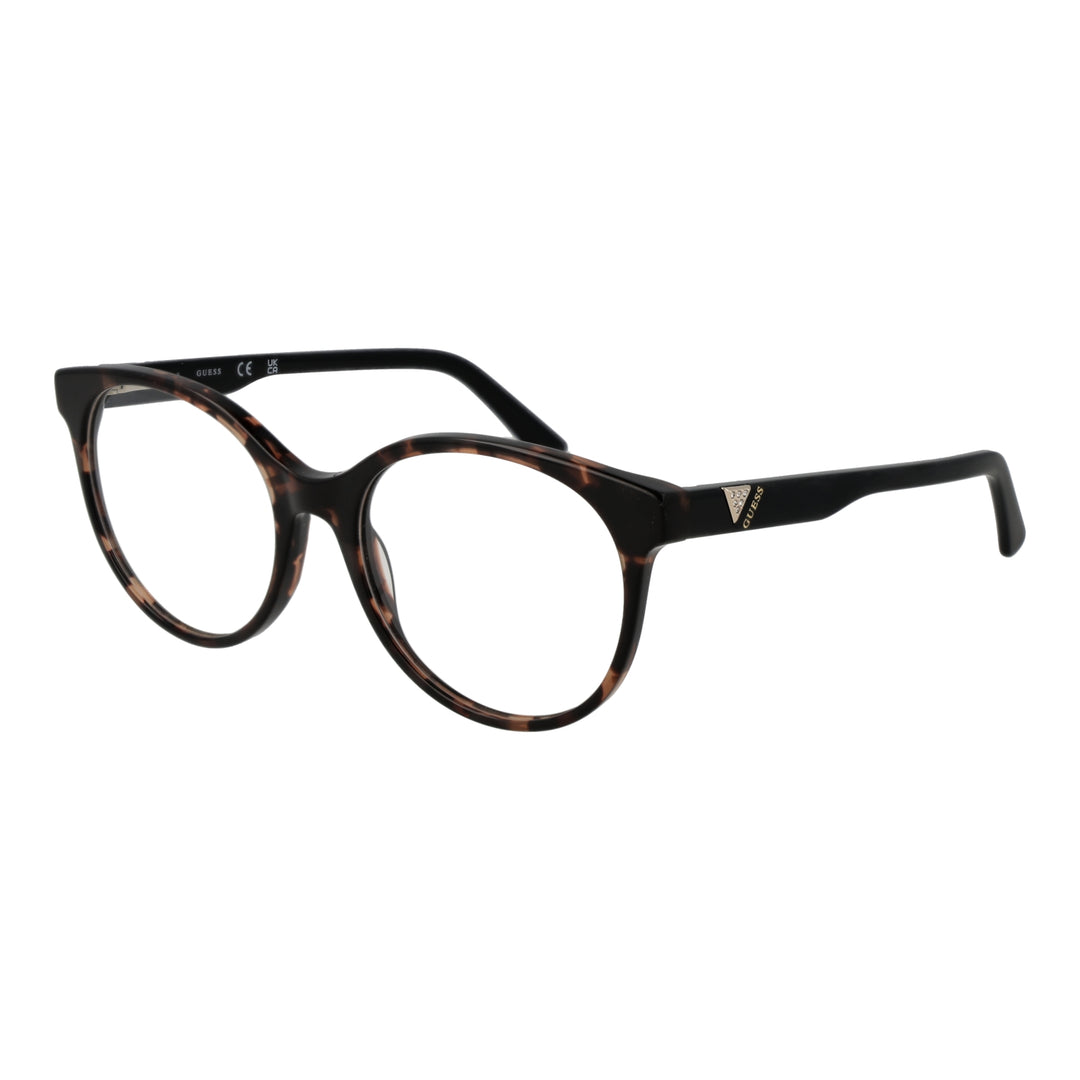 Tortoiseshell round eyeglasses with black temples and temple logo on neutral background
