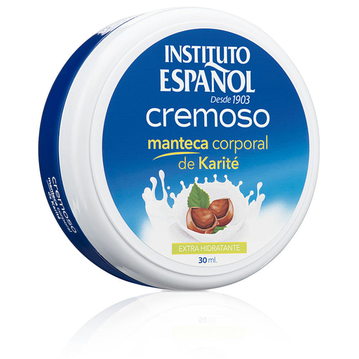Instituto Español Round blue-and-white plastic body butter container with label showing shea nuts, leaves, and milk splash