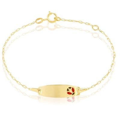 Delicate gold chain bracelet with small oval plate and clasp on neutral background